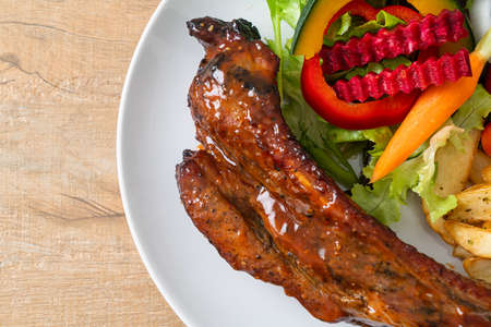 grill barbecue pork spare ribs with vegetablesの写真素材