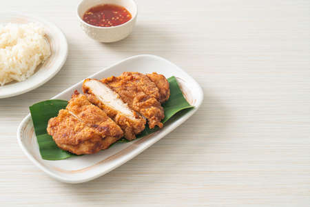 fried chicken with sticky rice and spicy sweet sauceの写真素材