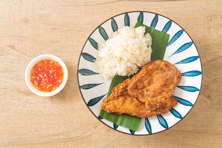 fried chicken with sticky rice and spicy sweet sauceの写真素材
