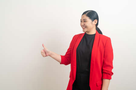 portrait Asian woman with thumb up white backgroundの写真素材