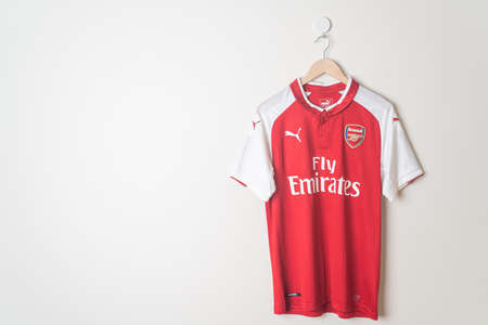 Bangkok, Thailand - Jan 18, 2022 : Arsenal retro shirt home jersey season 2017-2018 hanging on wallのeditorial素材