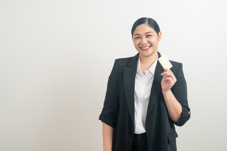 portrait Asian woman holding credit card with white backgroundの写真素材