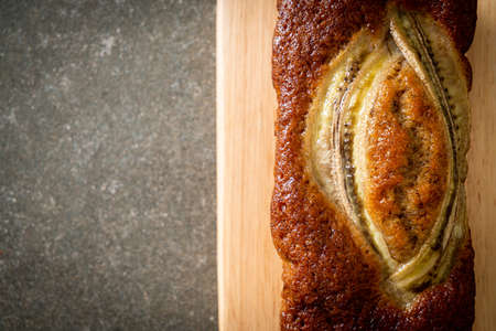 homemade banana cake on wood boardの写真素材