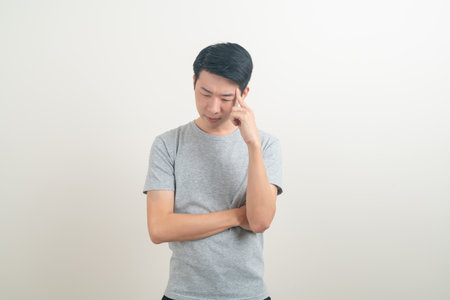 portrait young Asian man thinking on white backgroundの写真素材