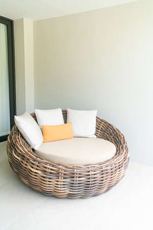 comfortable pillows on outdoor patio wicker sofa