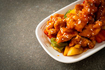 fried crispy chicken with sweet and sour sauce in Korean styleの写真素材