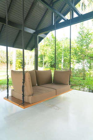empty sofa swing in garden for relax time