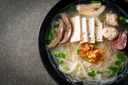 Vietnamese Rice Noodles Soup with Vietnamese Sausage served vegetables and crispy onion - Asian food...