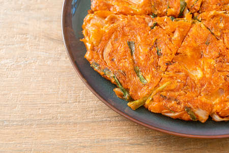 Korean Kimchi pancake or Kimchijeon - Fried Mixed Egg, Kimchi, and Flour - Korean food style