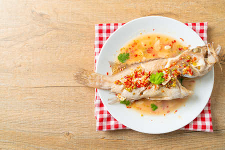 Steamed grouper fish with lime and chillies - Asian food styleの写真素材