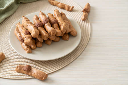 chocolate meringue stick on plate - French snack and dessert styleの写真素材