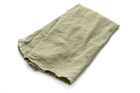 dark green napkin isolated on white backgroundの写真素材