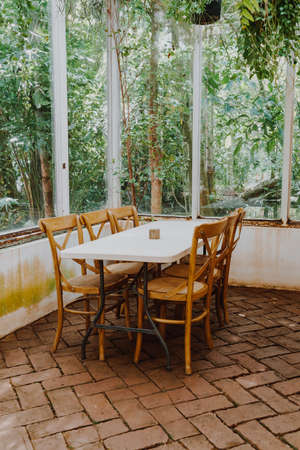 empty wood chair and table in restaurant - vintage effect filterの写真素材