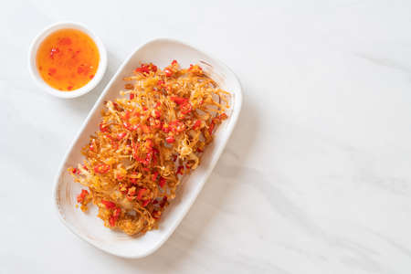 Fried Enoki Mushroom or Golden Needle Mushroom with Salt and Chilli - vegan and vegetarian food styleの写真素材
