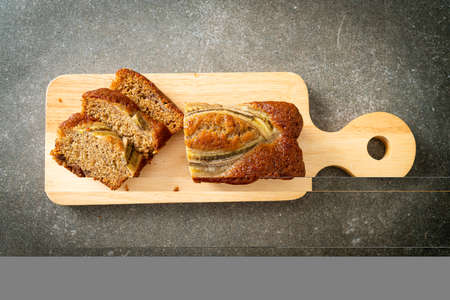 banana cake sliced on wood board