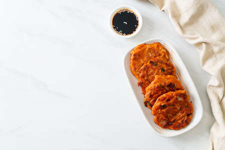 Korean Kimchi pancake or Kimchijeon - Fried Mixed Egg, Kimchi, and Flour - Korean traditional food...