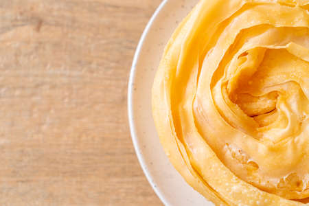 fried crispy roti dough with sweetened condensed milk