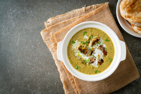 Afghani chicken in green masala curry or Hariyali tikka chicken hara masala with roti or naan bread...