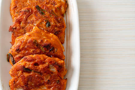 Korean Kimchi pancake or Kimchijeon - Fried Mixed Egg, Kimchi, and Flour - Korean traditional food styleの写真素材