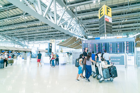 Bangkok, Thailand - May 23, 2022 : Bangkok Suvarnabhumi airport passengers inside the departure terminal, tourist and traveler in medical masks from coronavirus.のeditorial素材