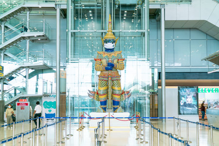 Bangkok, Thailand - May 23, 2022 : Bangkok Suvarnabhumi airport passengers inside the departure terminal, tourist and traveler in medical masks from coronavirus.のeditorial素材