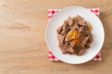 homemade stir-fried pork liver with garlic on plate