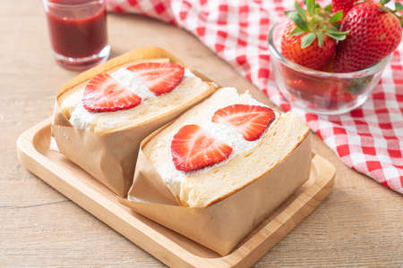 pancake sandwich strawberry fresh cream on wood plate