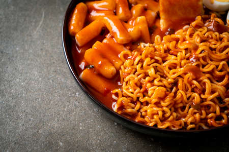 Korean instant noodles with Korean rice cake and fish cake and boiled egg - Rabokki - Korean food...