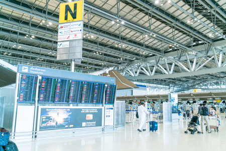 Bangkok, Thailand - May 23, 2022 : Bangkok Suvarnabhumi airport passengers inside the departure terminal, tourist and traveler in medical masks from coronavirus.のeditorial素材
