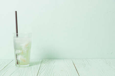 coconut water or coconut juice in glas with ice cube