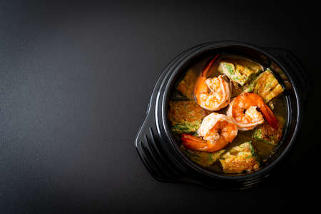 Sour soup made of Tamarind Paste with Shrimps and Vegetable Omelet - Asian food style