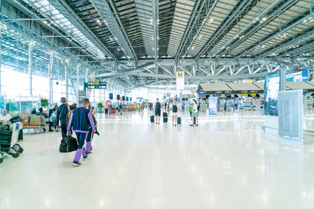 Bangkok, Thailand - May 23, 2022 : Bangkok Suvarnabhumi airport passengers inside the departure terminal, tourist and traveler in medical masks from coronavirus.のeditorial素材