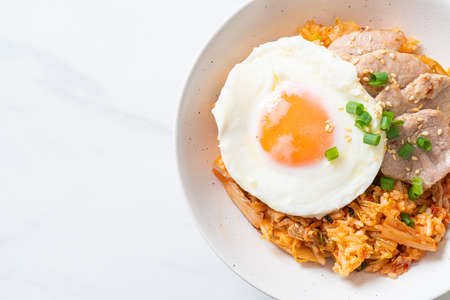 Kimchi fried rice with fried egg and pork - Korean food styleの写真素材