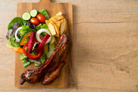 grill barbecue pork spare ribs with vegetables
