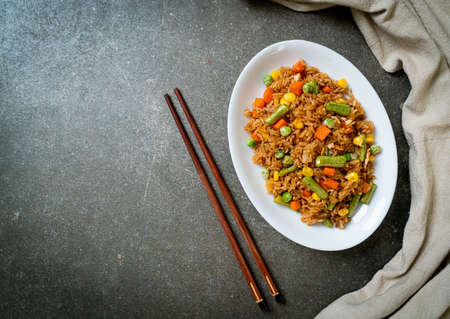 fried rice with green peas, carrot and corn - vegetarian and healthy food style