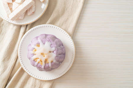 taro bun with white sugar cream and nut on top