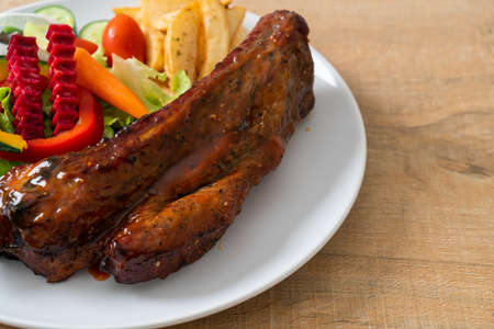 grill barbecue pork spare ribs with vegetablesの写真素材