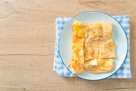 fried roti with egg and sweetened condensed milkの写真素材