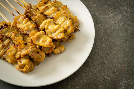 Pork satay with peanut sauce pickles which are cucumber slices and onions in vinegar - Asian food styleの写真素材