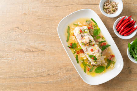 steamed sea bass fish fillet steak with herbs