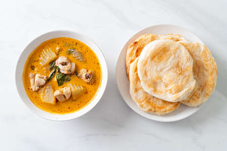 Chicken curry soup with roti or naan with chicken tikka masala - Asian food styleの写真素材