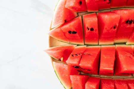 fresh watermelon sliced on wooden plateの写真素材