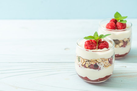 fresh raspberry and yogurt with granola - Healthy food styleの写真素材