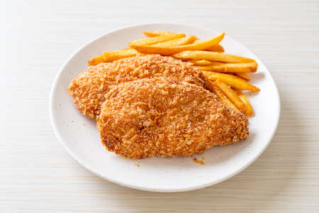 fried chicken breast fillet steak with French fries and ketchupの写真素材