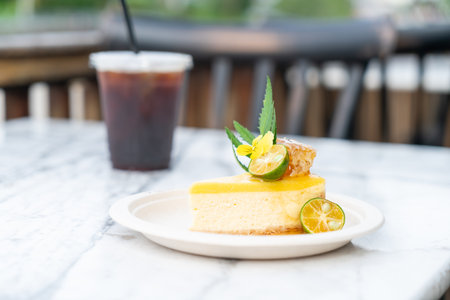 honey and kumquat cheese cake on table in coffee shop cafe restaurantの写真素材