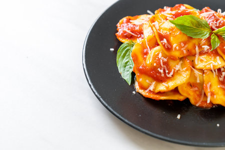 Ravioli with tomato sauce and basil - Italian food styleの写真素材