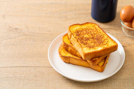 french toast on white plate for breakfastの写真素材