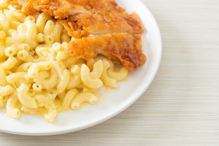 Homemade Mac and cheese with fried chickenの写真素材