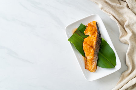 Grilled Salmon Steak with Soy Sauce on plate - Japanese food styleの写真素材