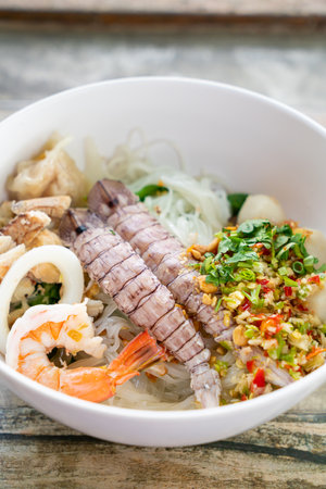 spicy seafood noodles bowl in Thai style - Tom Yum Noodlesの写真素材